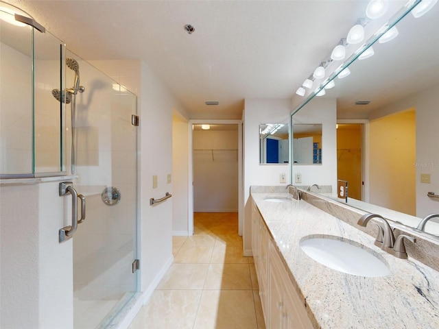 5300 S Atlantic Ave Unit 9201, New Smyrna Beach, FL 32169 - bathroom with large vanity, double sink, a shower with door, and tile flooring