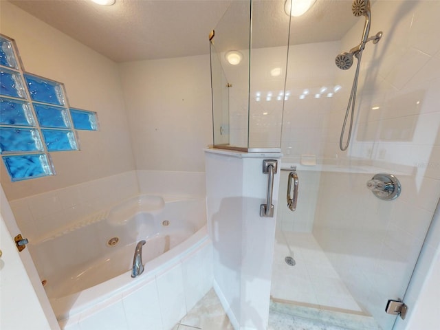 5300 S Atlantic Ave Unit 9201, New Smyrna Beach, FL 32169 - bathroom with a textured ceiling, separate shower and tub, and tile flooring