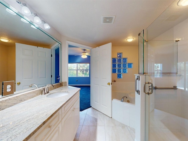 5300 S Atlantic Ave Unit 9201, New Smyrna Beach, FL 32169 - bathroom with shower with separate bathtub, tile floors, vanity with extensive cabinet space, and ceiling fan