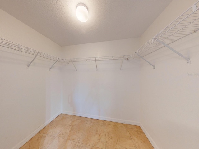 5300 S Atlantic Ave Unit 9201, New Smyrna Beach, FL 32169 - walk in closet featuring light tile floors