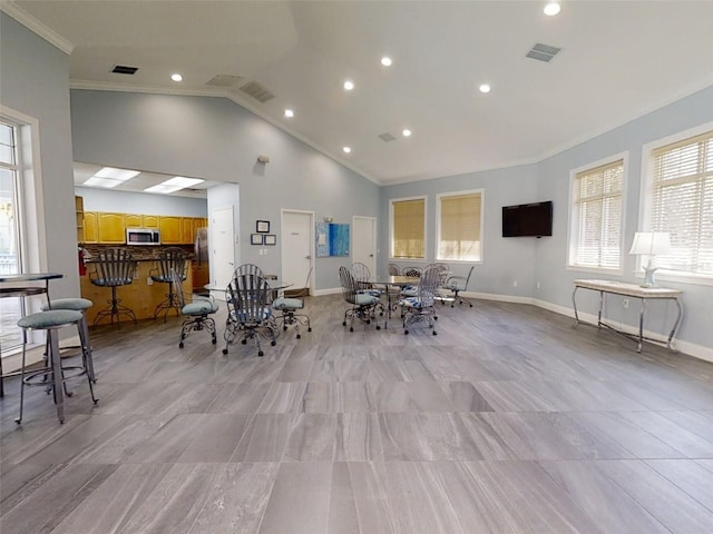 5300 S Atlantic Ave Unit 9201, New Smyrna Beach, FL 32169 - dining room featuring vaulted ceiling, crown molding, and light tile flooring
