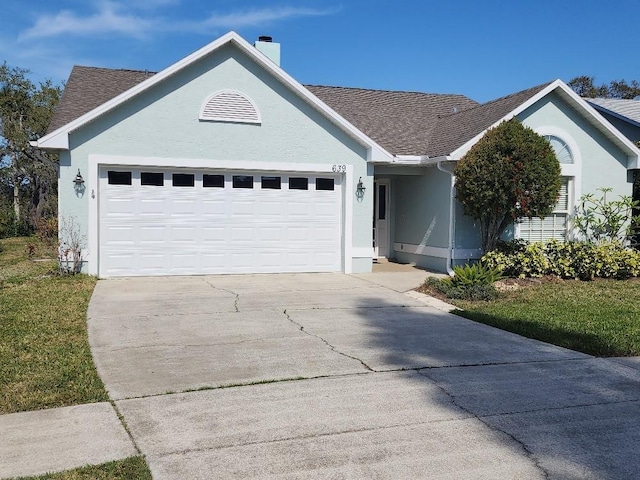 ranch-style home with a front yard and a garage