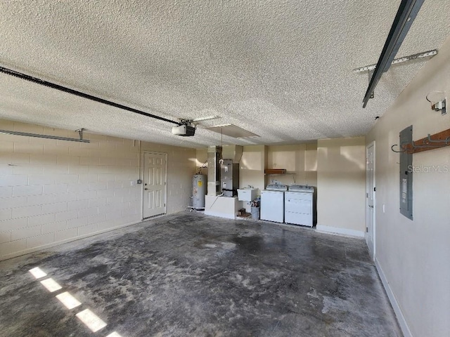 garage with water heater, washer and clothes dryer, heating utilities, and a garage door opener