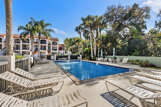 view of swimming pool with a patio area