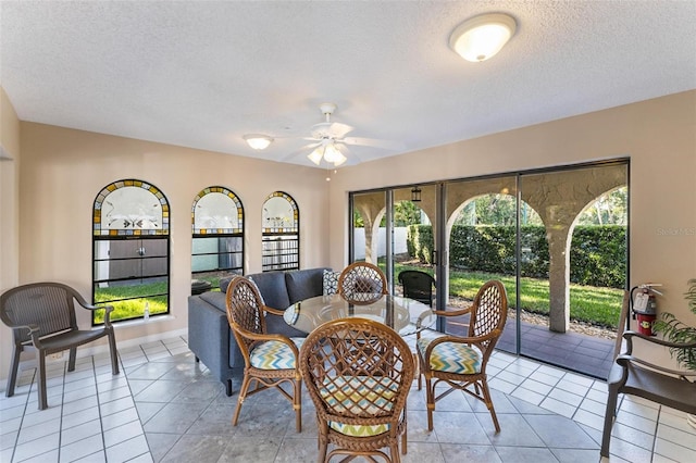 sunroom featuring ceiling fan