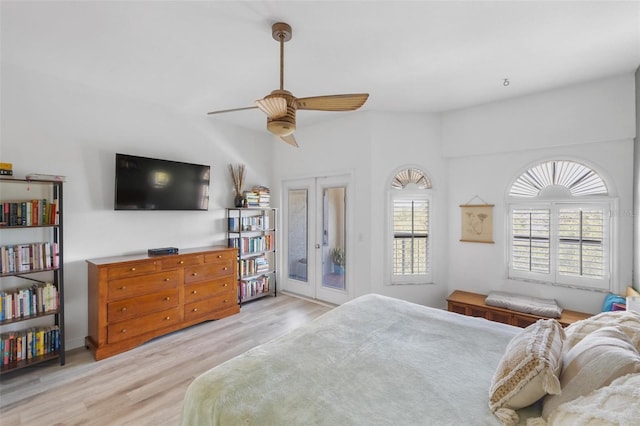 bedroom featuring light hardwood / wood-style flooring, access to exterior, ceiling fan, and french doors