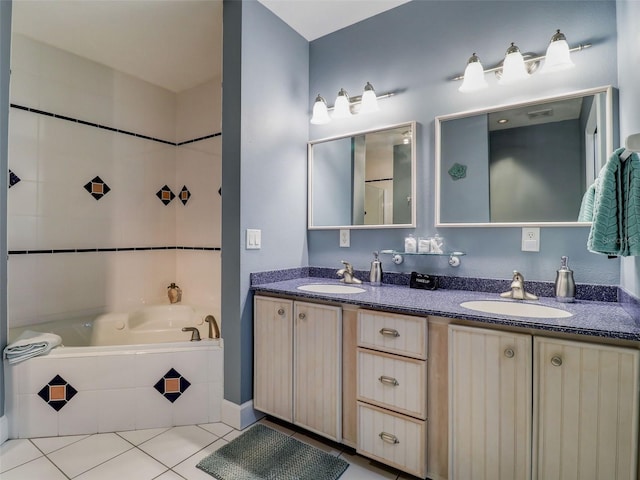 bathroom featuring tile floors, dual sinks, tiled tub, and large vanity
