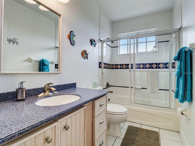 full bathroom with toilet, shower / bath combination with glass door, tile floors, and vanity