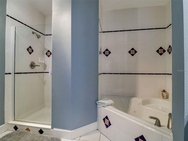 bathroom featuring tile floors and independent shower and bath