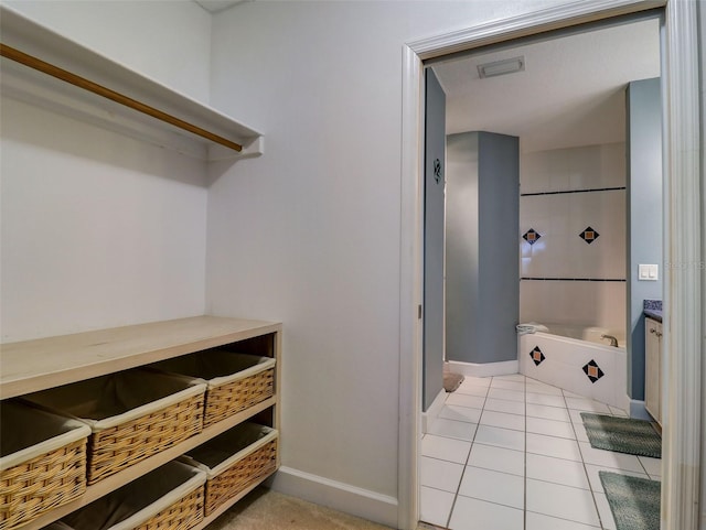 bathroom featuring tile floors