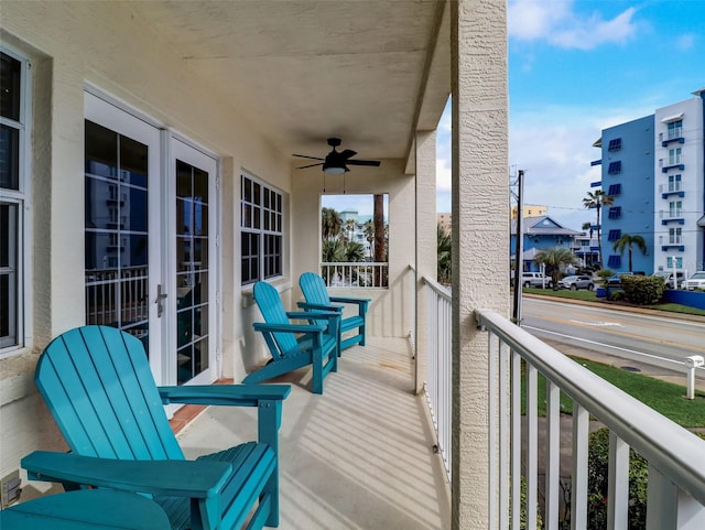 wooden terrace featuring ceiling fan