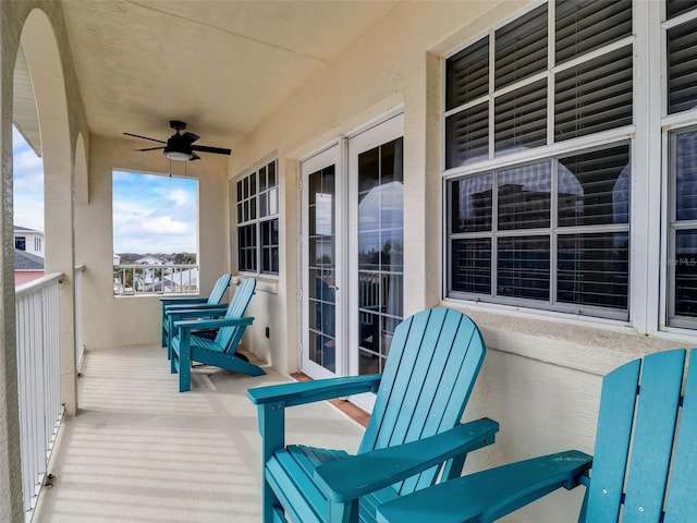 wooden deck featuring ceiling fan