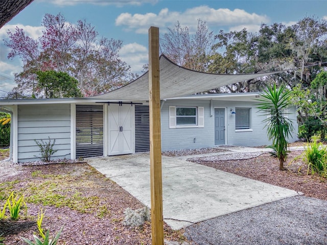 view of front of house with a patio area