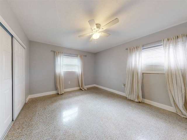 unfurnished bedroom with a closet and ceiling fan