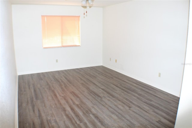 empty room with dark hardwood / wood-style floors