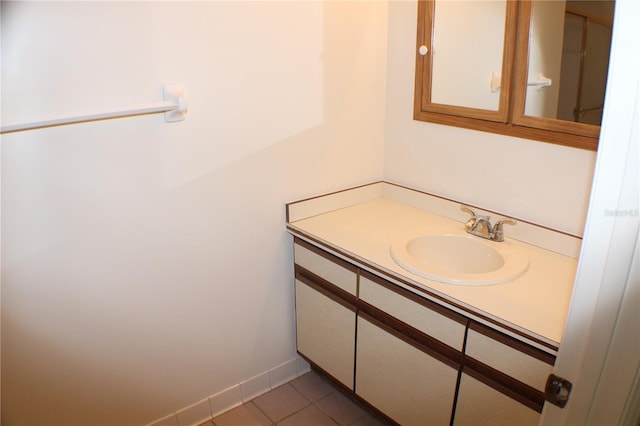 bathroom featuring tile patterned flooring and vanity