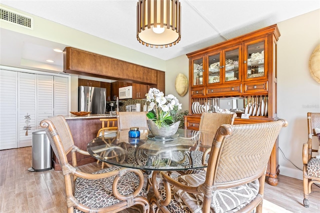 dining area featuring light hardwood / wood-style floors