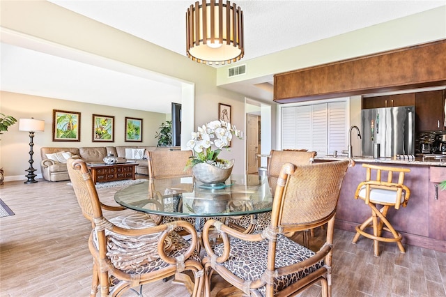 dining room with light hardwood / wood-style floors