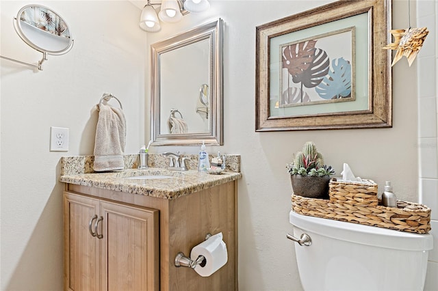 bathroom with toilet and vanity