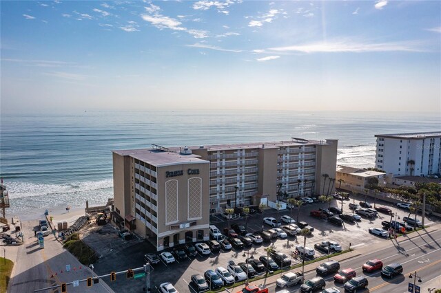 drone / aerial view with a view of the beach and a water view