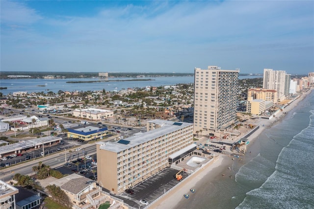 bird's eye view with a water view and a view of the beach