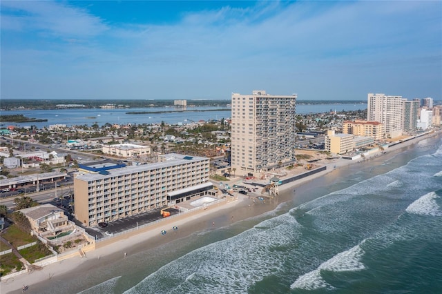 drone / aerial view featuring a view of the beach and a water view