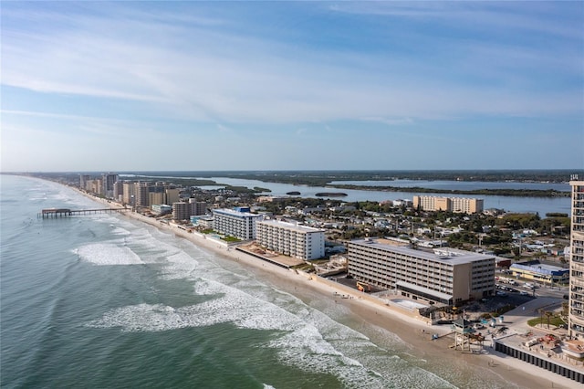 bird's eye view with a water view and a view of the beach