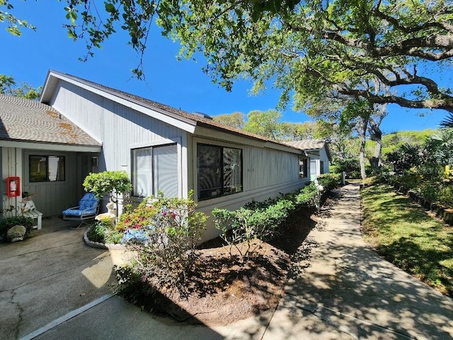 view of side of home with a patio