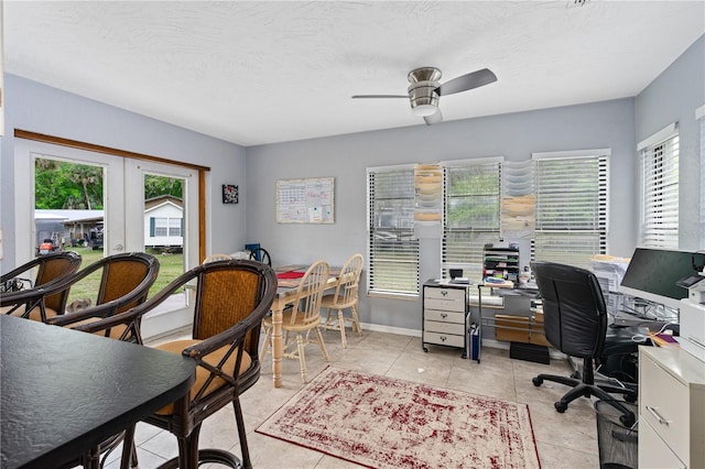 tiled office with french doors, a textured ceiling, and ceiling fan