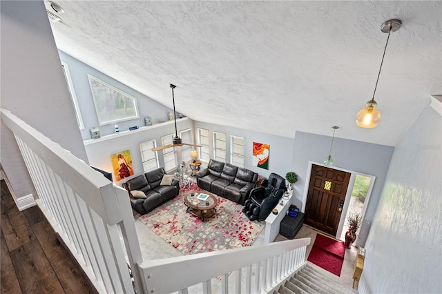 living room with dark hardwood / wood-style floors and vaulted ceiling