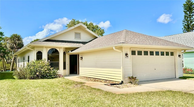 ranch-style home featuring concrete driveway, an attached garage, a front lawn, and a shingled roof