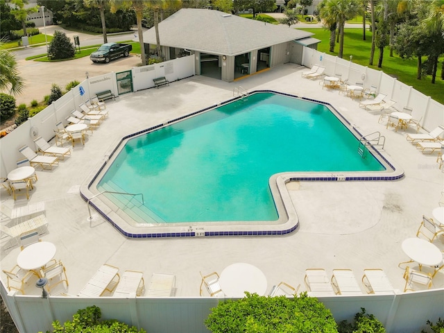 view of swimming pool with a patio