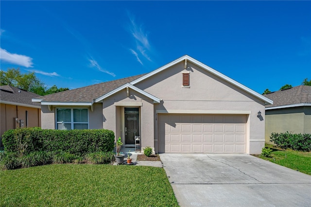 ranch-style house featuring a front yard and a garage