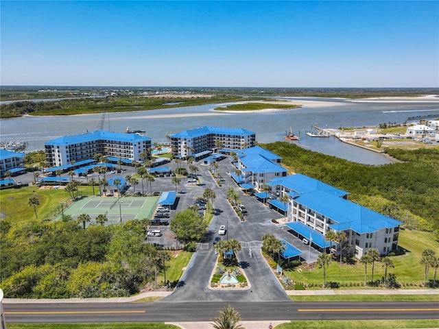 birds eye view of property with a water view