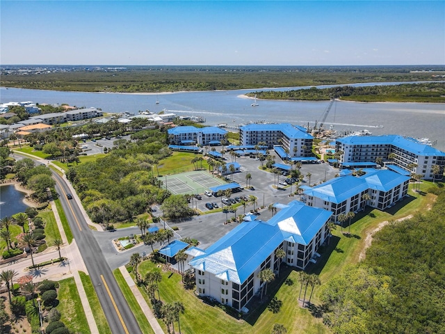 birds eye view of property with a water view