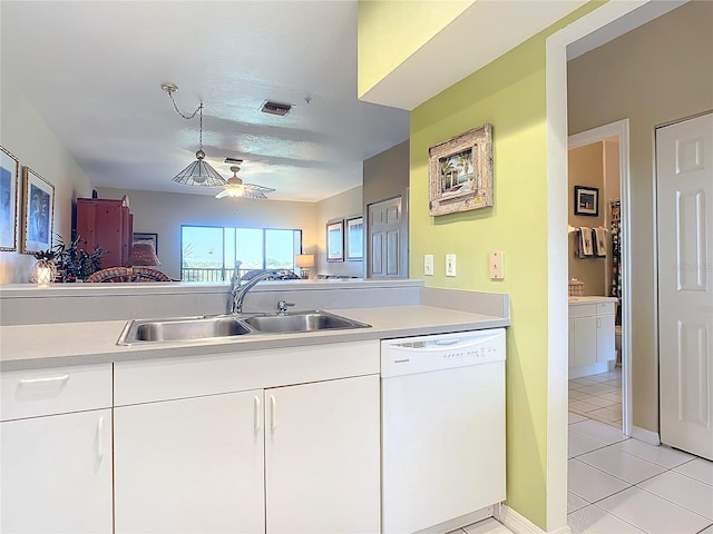 kitchen with white cabinets, ceiling fan, light tile patterned floors, dishwasher, and sink