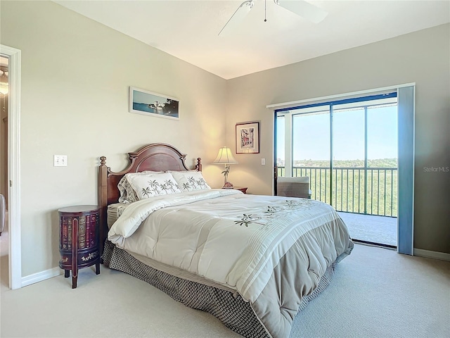 bedroom featuring access to exterior, light colored carpet, and ceiling fan