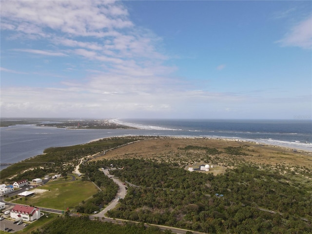 drone / aerial view featuring a water view and a beach view