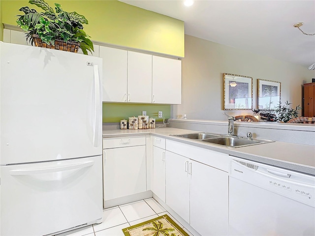 kitchen with kitchen peninsula, white cabinetry, light tile patterned flooring, sink, and white appliances