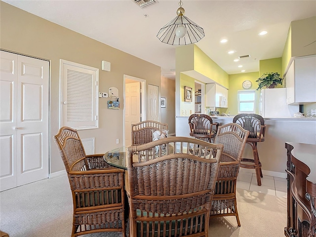 view of carpeted dining space