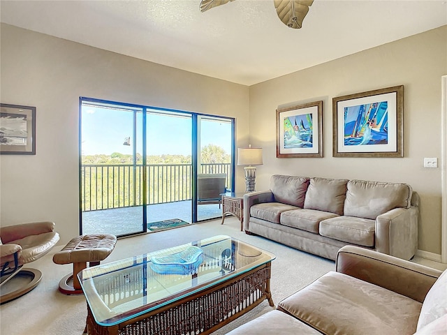 living room featuring a textured ceiling and carpet