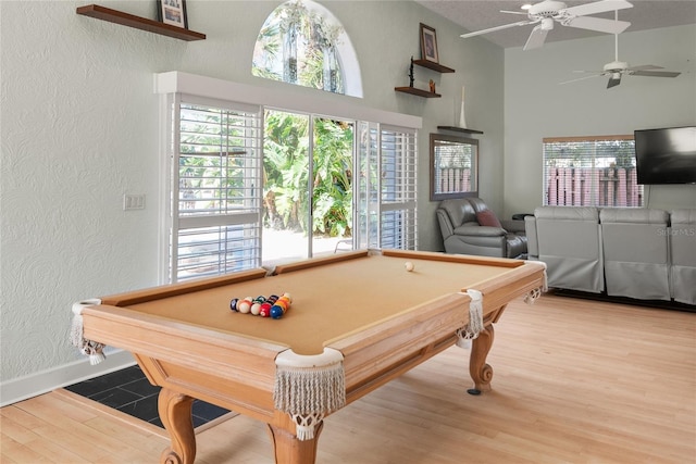 recreation room featuring a textured ceiling, hardwood / wood-style flooring, billiards, and ceiling fan