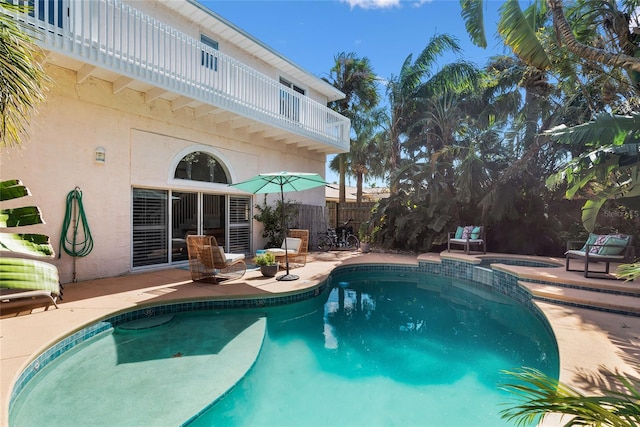 view of swimming pool with a patio