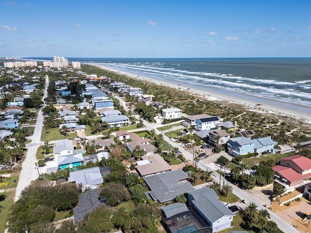 aerial view featuring a water view and a view of the beach