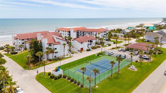 drone / aerial view with a water view and a view of the beach