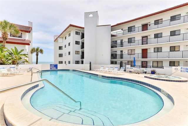 view of swimming pool with a patio