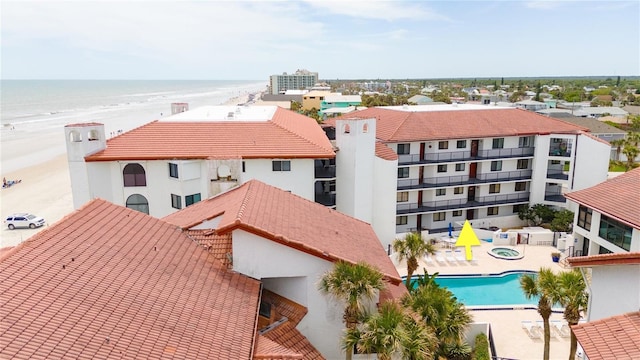 aerial view with a view of the beach and a water view