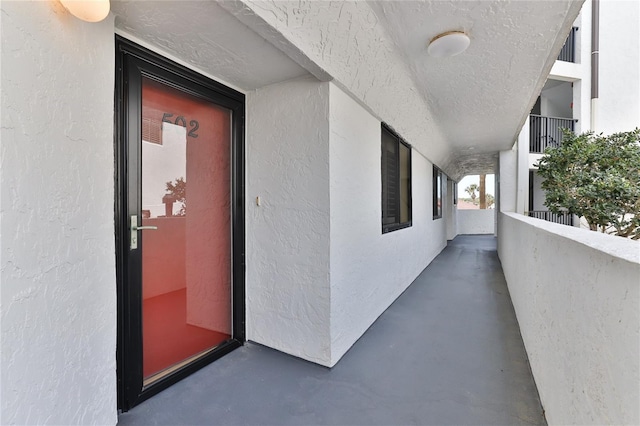 entrance to property featuring a balcony