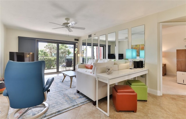 living room featuring ceiling fan and light tile patterned floors