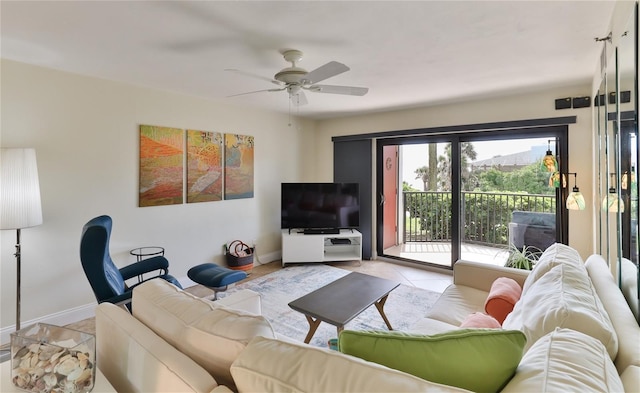 living room with ceiling fan and light tile patterned flooring